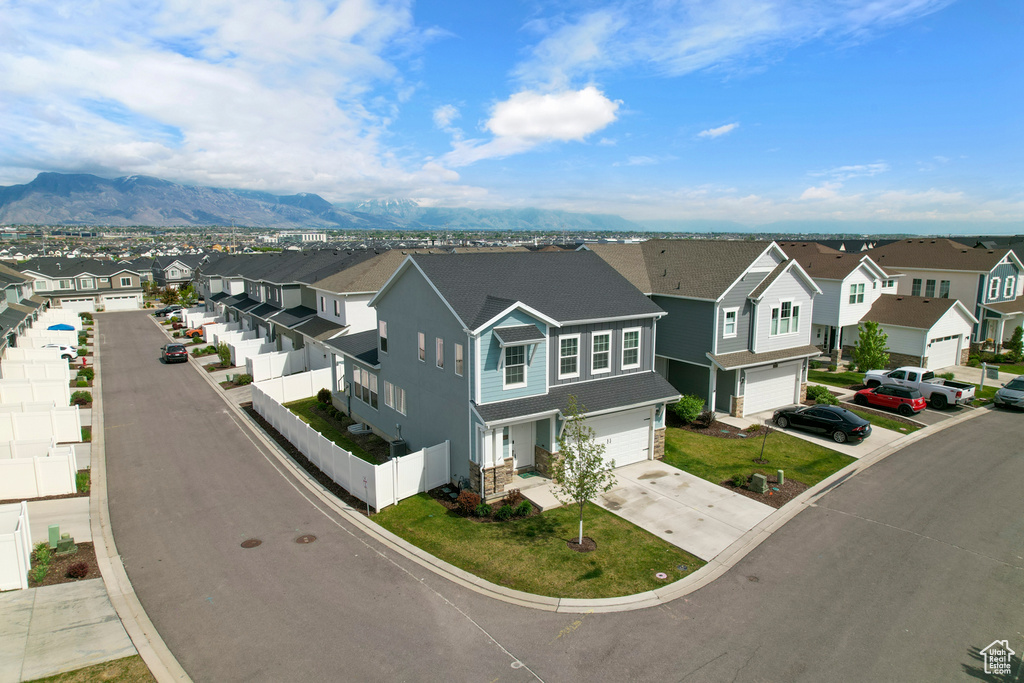 Aerial view of residential area with a mountainous background
