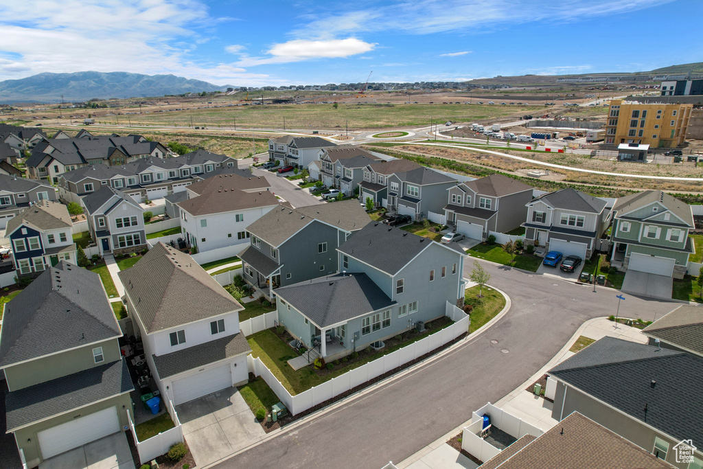Aerial view of residential area with a mountainous background