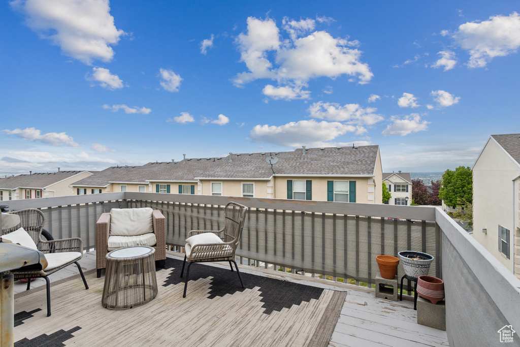 Wooden terrace featuring a residential view