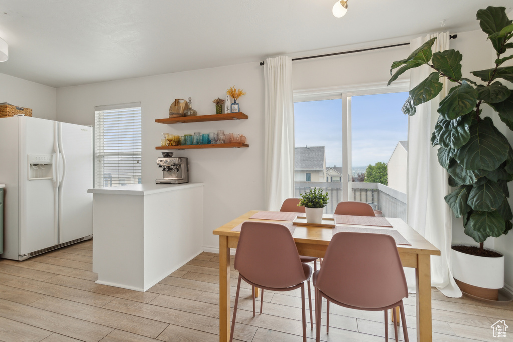 Dining area with light wood finished floors