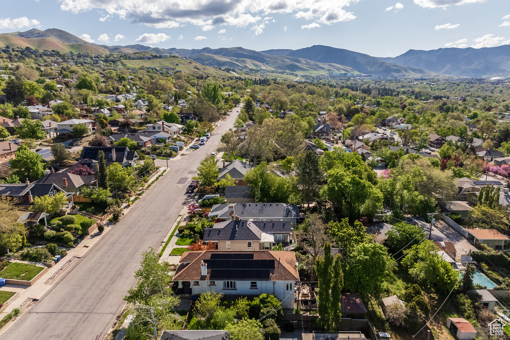Aerial perspective of suburban area with a mountain backdrop