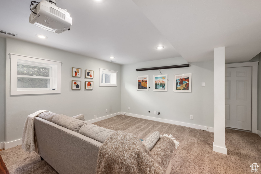 Living area with baseboards, carpet flooring, and recessed lighting