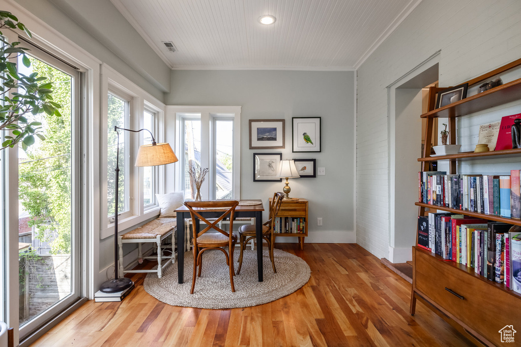 Office area with wood finished floors, ornamental molding, baseboards, and recessed lighting