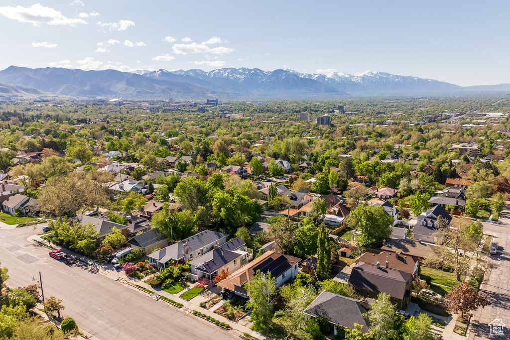 Aerial view of residential area featuring a mountainous background