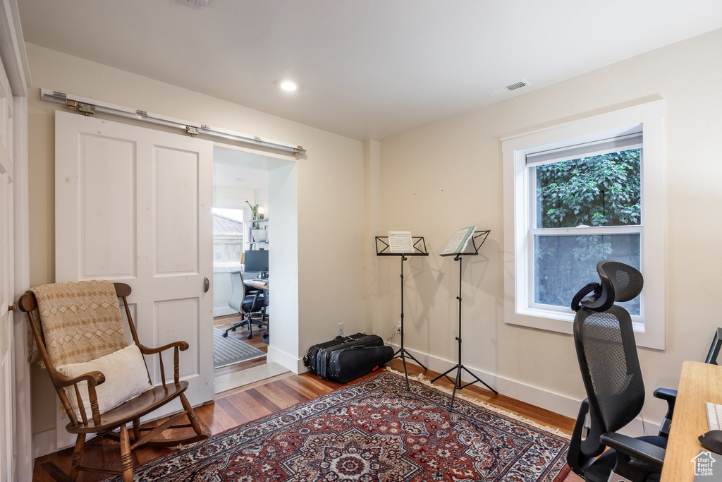Office featuring wood finished floors, baseboards, and recessed lighting