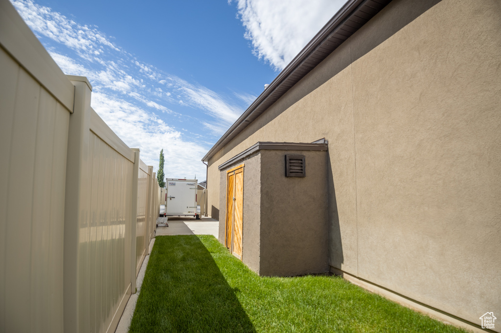View of side of home with stucco siding