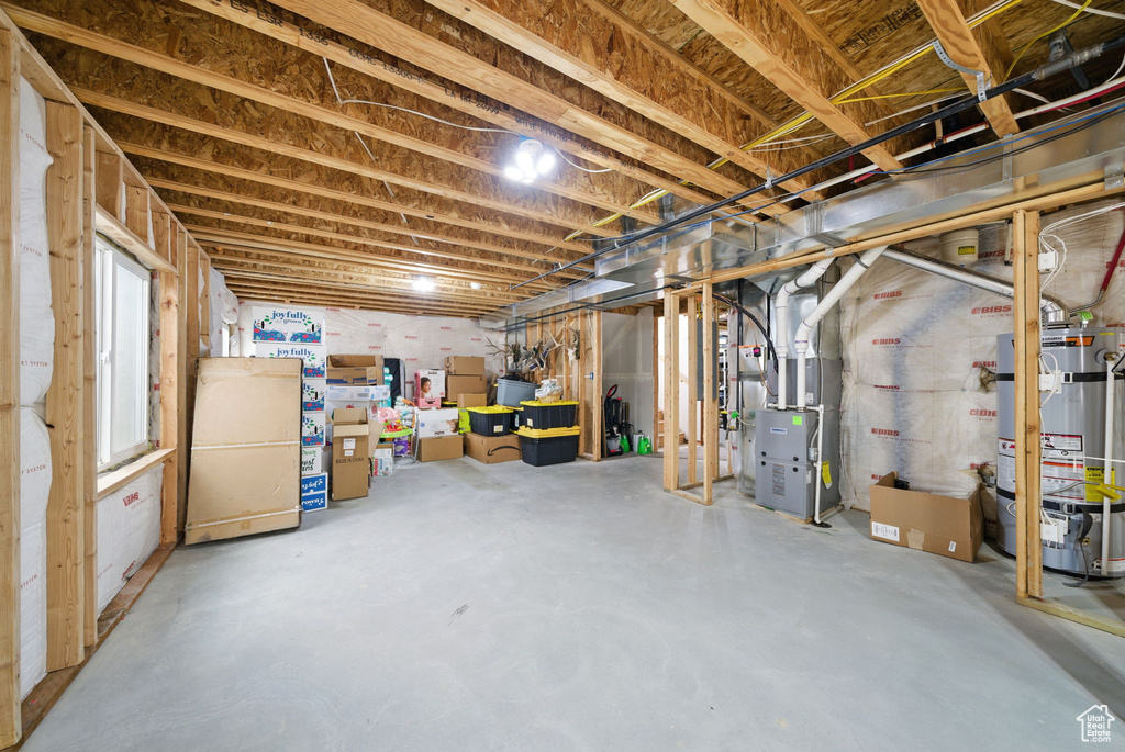 Below grade area with water heater and heating unit