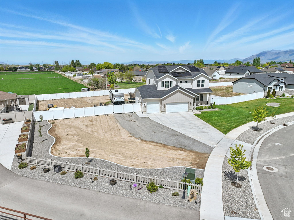 Aerial view of residential area featuring a mountain backdrop