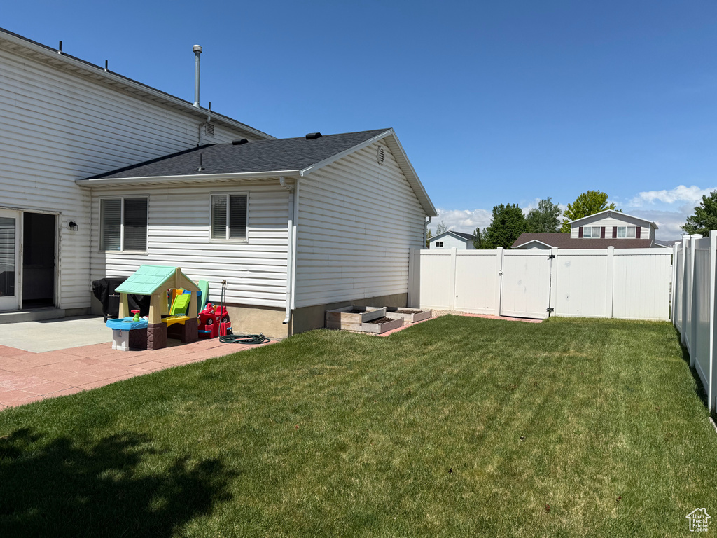 Rear view of property with a patio area