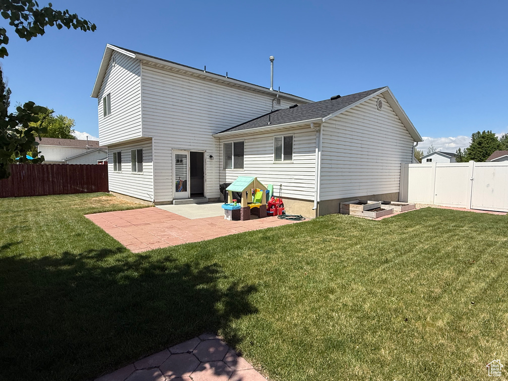 Back of property with a patio area