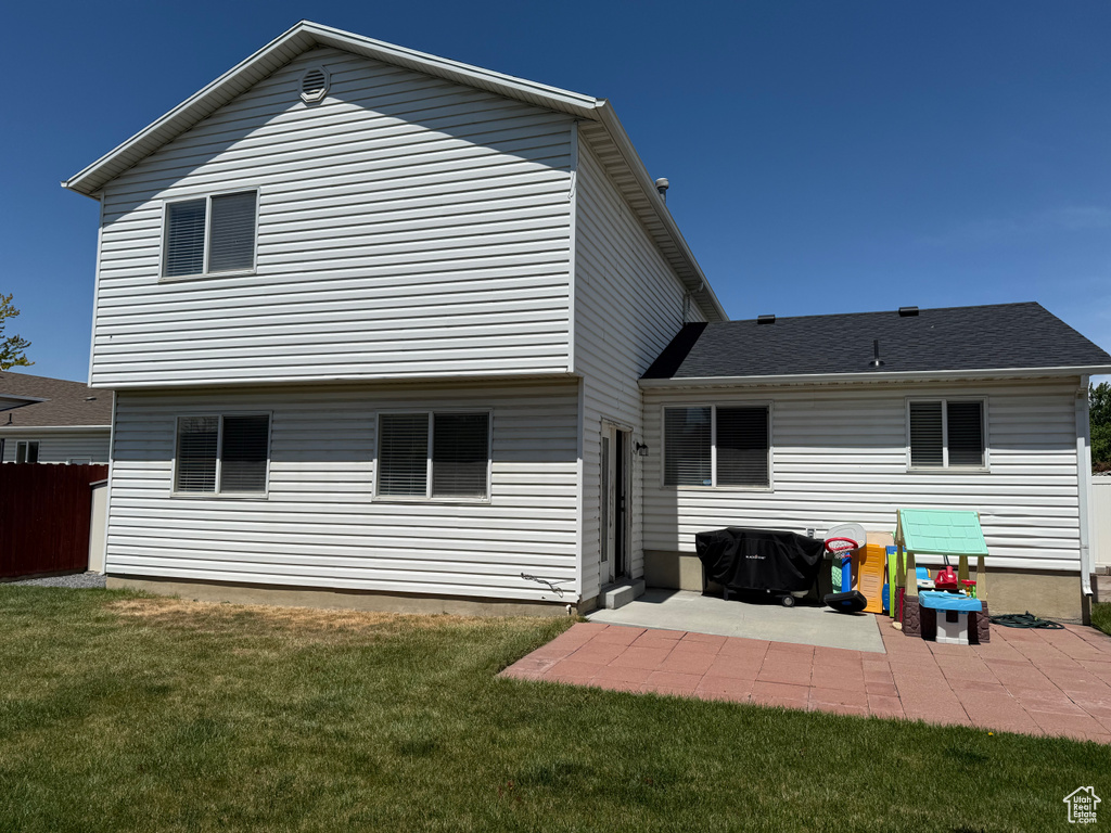 Back of property with a patio area