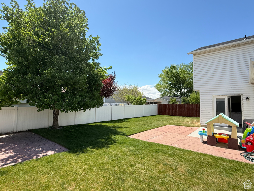View of yard with a patio