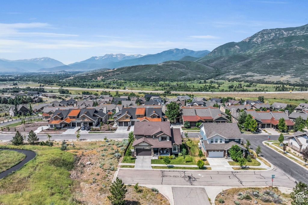 Drone / aerial view with a residential view and a mountain view