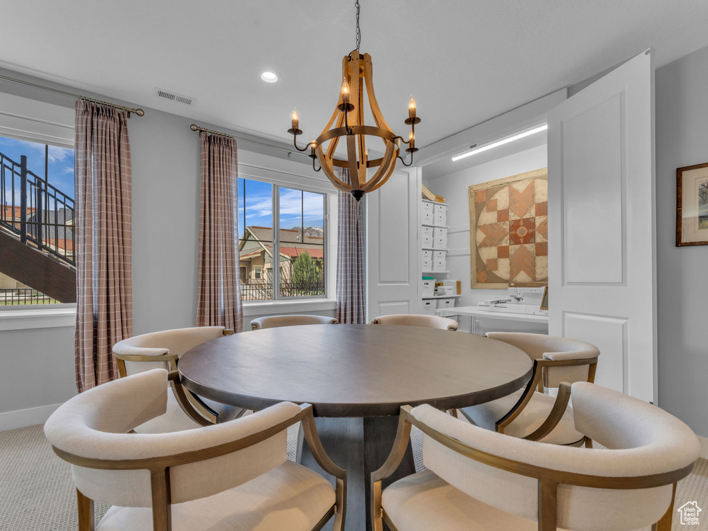 Dining room featuring recessed lighting, a notable chandelier, baseboards, and visible vents