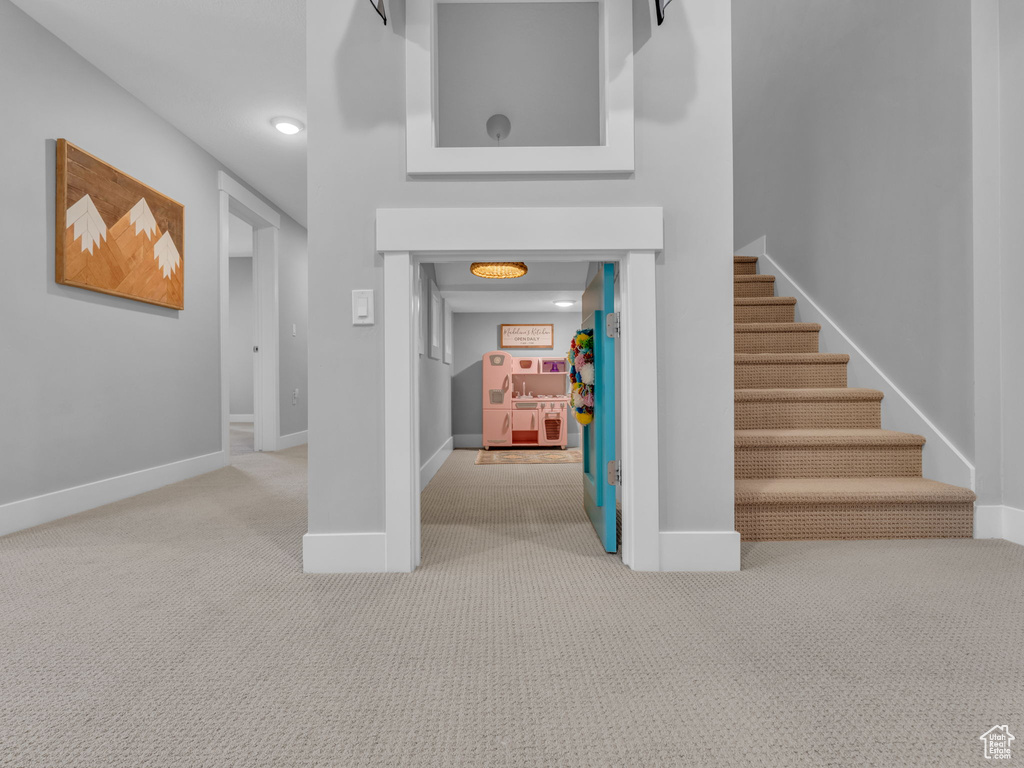 Interior space with baseboards and carpet