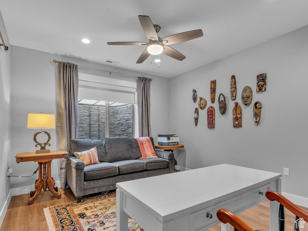Office area with a ceiling fan, light wood-style flooring, recessed lighting, and baseboards