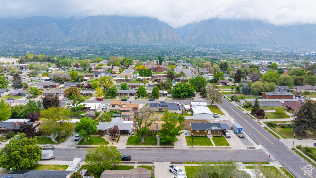 Aerial perspective of suburban area featuring a mountainous background