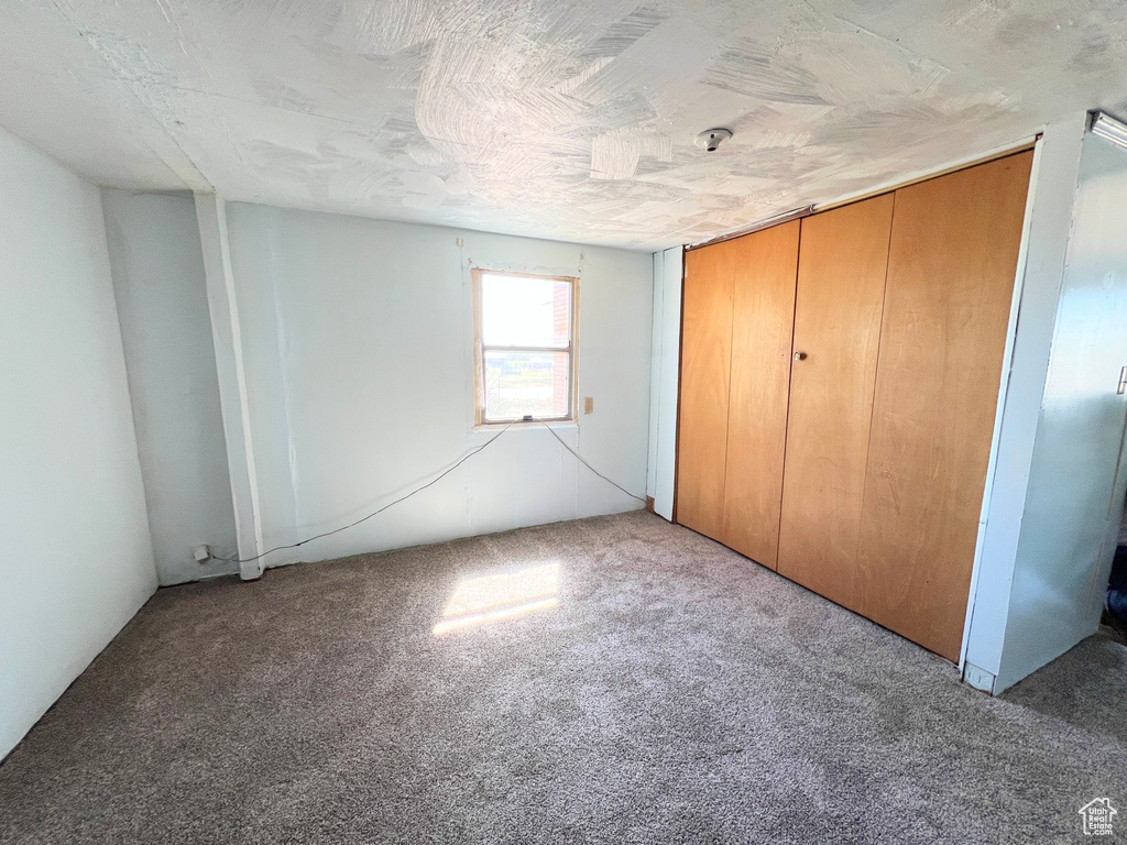 Unfurnished bedroom featuring carpet