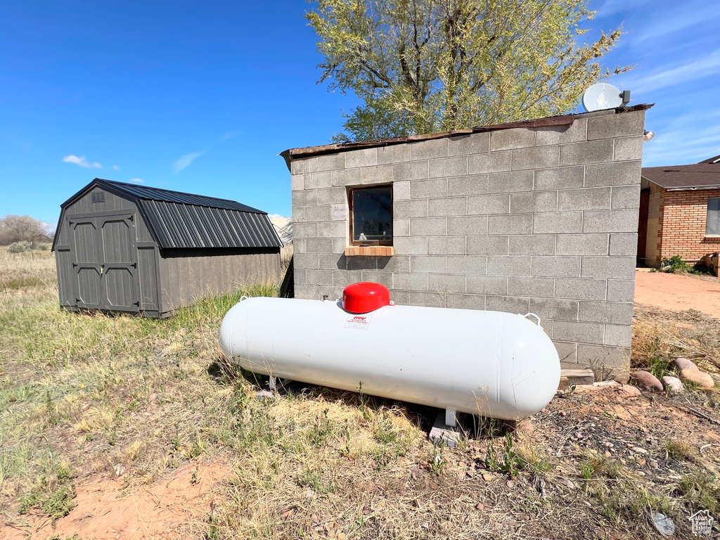 Exterior view of heating fuel tank and a satellite dish