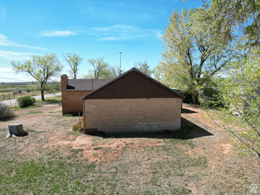 View of home's exterior featuring a chimney