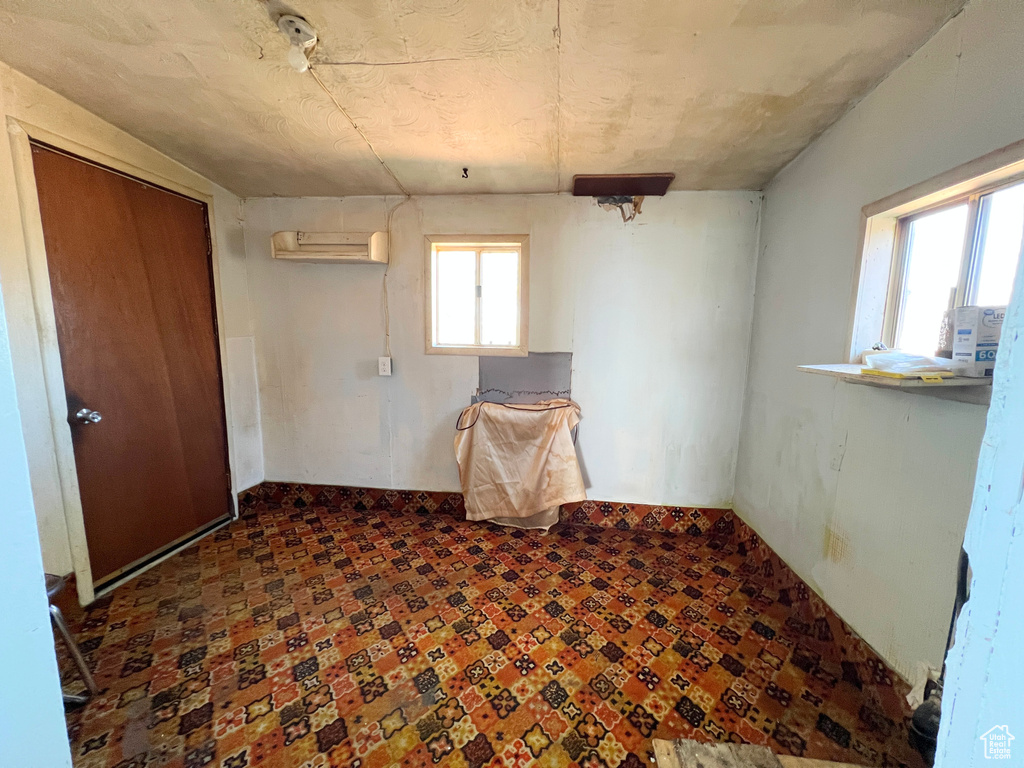 Spare room featuring a wall mounted AC