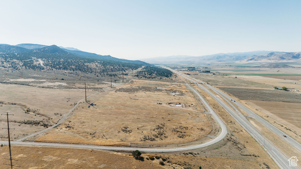Aerial view of sparsely populated area with a mountain backdrop