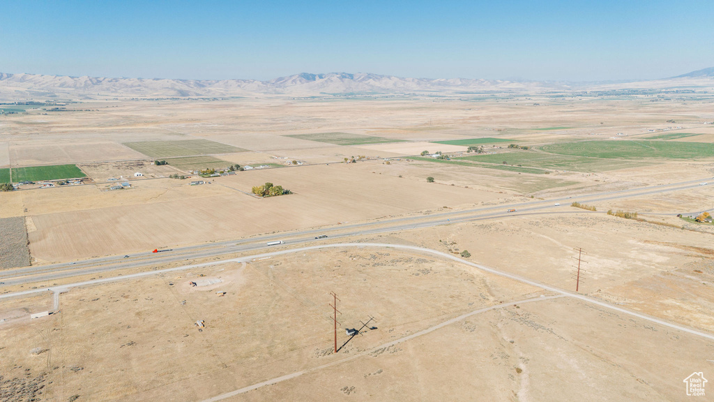 Aerial view of sparsely populated area with mountains and a desert landscape