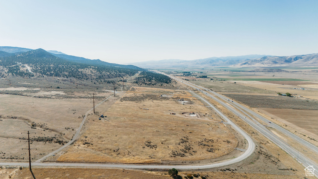 Aerial view of sparsely populated area with a mountainous background