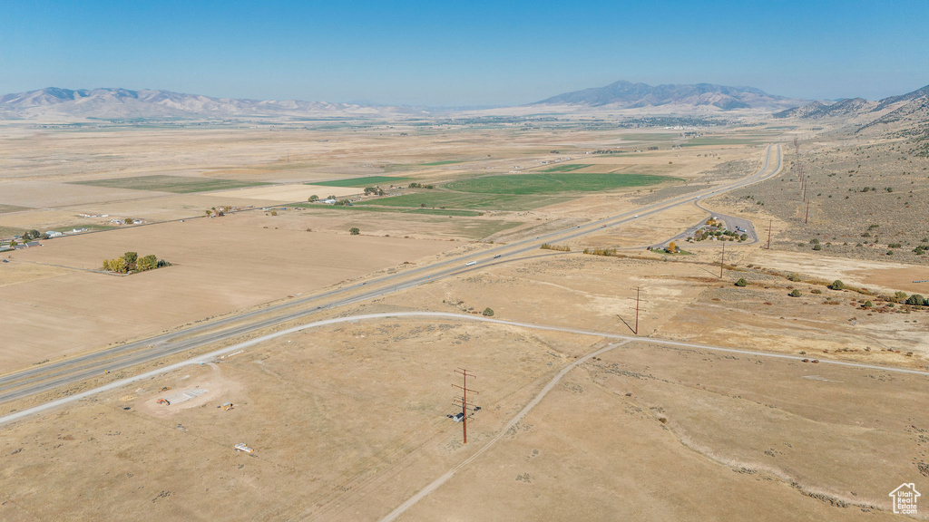Aerial view of sparsely populated area with mountains and a desert landscape