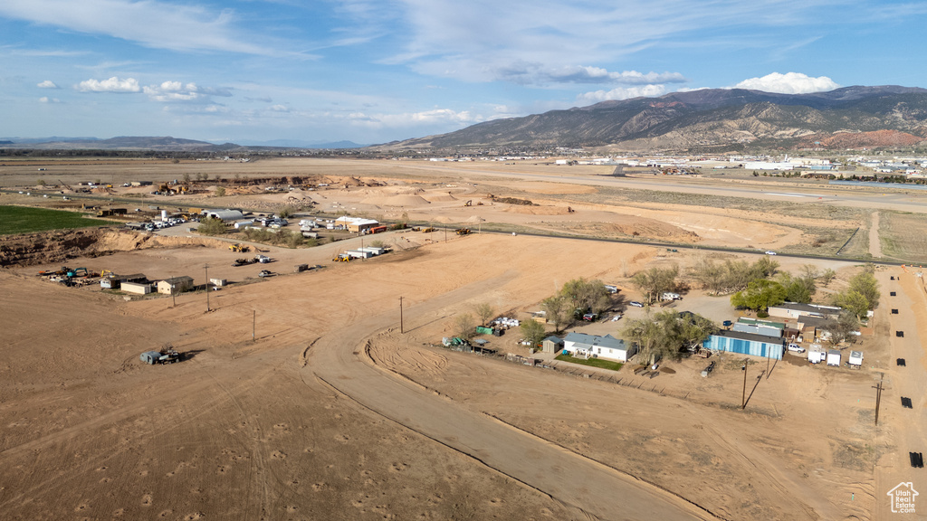Aerial overview of property's location with mountains and rural landscape
