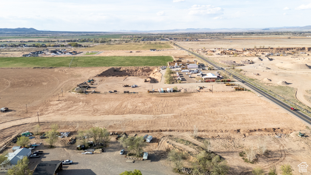 Aerial view of sparsely populated area featuring a mountainous background and a desert landscape