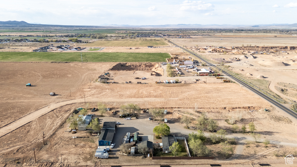 Aerial overview of property's location featuring rural landscape, a mountainous background, and a desert landscape