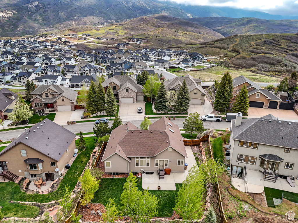 Aerial perspective of suburban area featuring a mountainous background