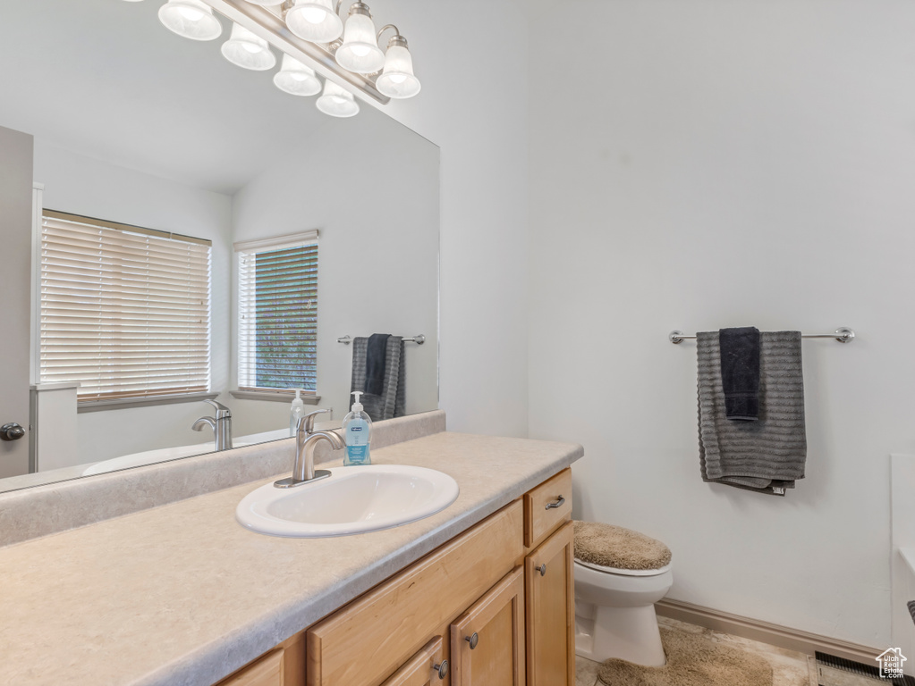 Bathroom featuring toilet and vanity