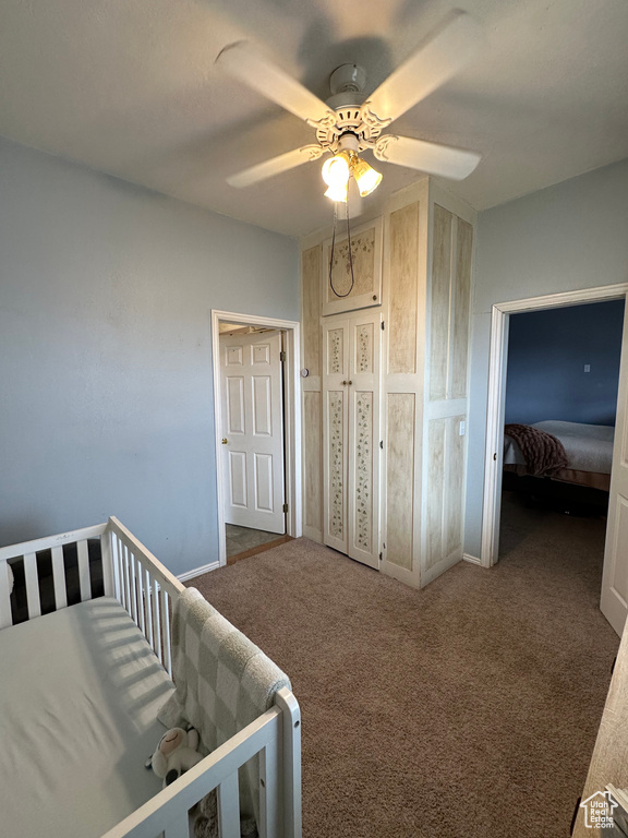 Bedroom featuring carpet floors, ceiling fan, and baseboards