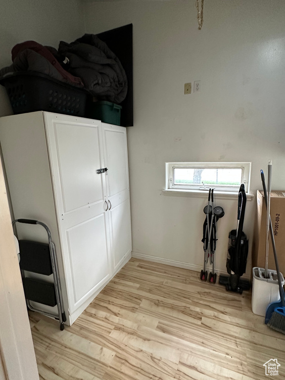 Unfurnished bedroom featuring light wood finished floors and baseboards