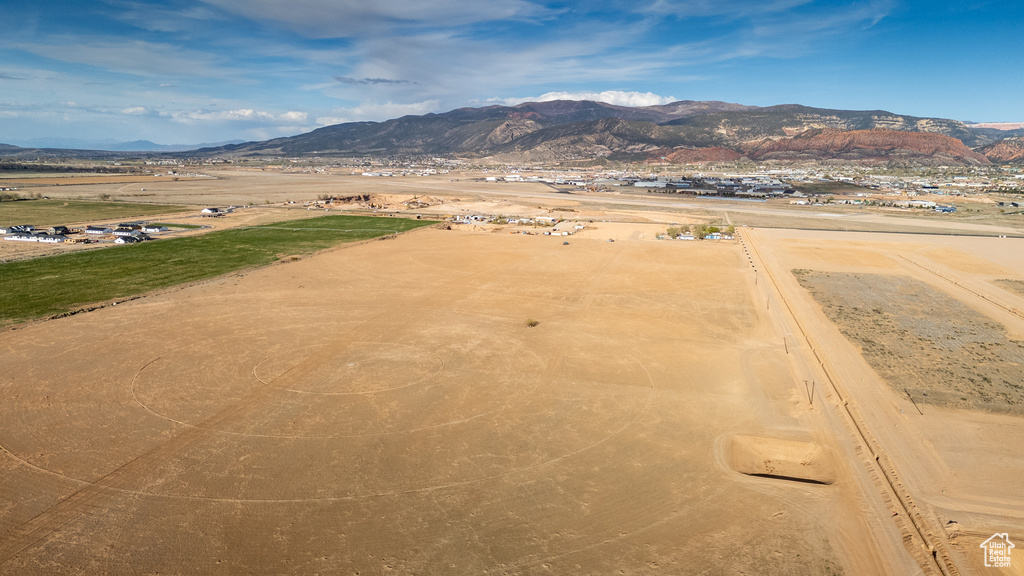 Overview of rural landscape featuring a mountainous background