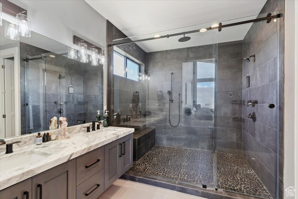 Bathroom with a stall shower and double vanity