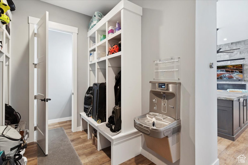 Mudroom featuring light wood finished floors