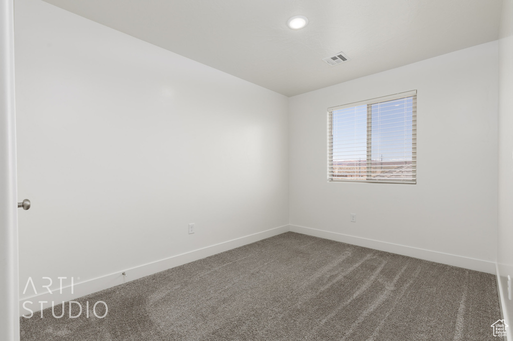Spare room with baseboards, carpet flooring, and recessed lighting