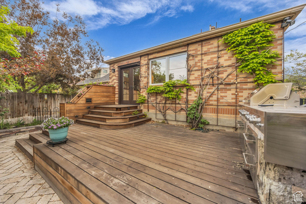 Wooden terrace with french doors and fence