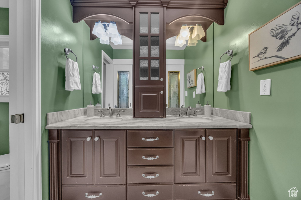 Bathroom with toilet and double vanity