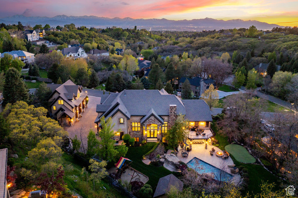 Birds eye view of property with a mountain view