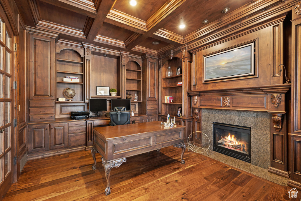 Office featuring coffered ceiling, ornamental molding, wood ceiling, built in shelves, and wood walls