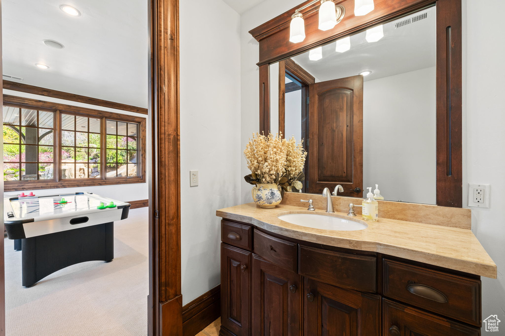 Bathroom featuring baseboards and vanity