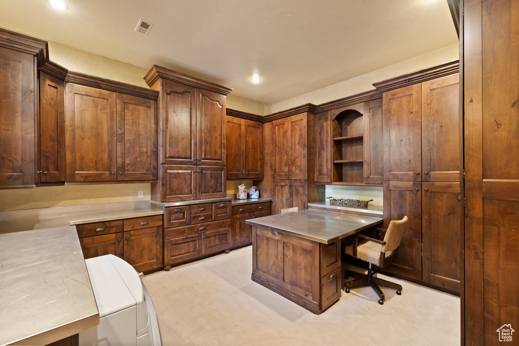 Home office with built in desk, light carpet, visible vents, and recessed lighting