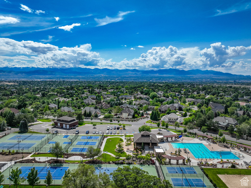 Drone / aerial view of a mountainous background and a pool area