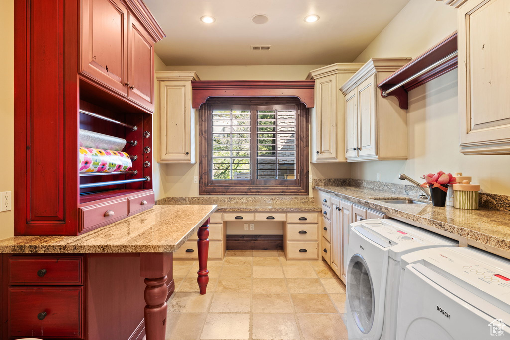 Laundry area with a sink, cabinet space, independent washer and dryer, visible vents, and recessed lighting