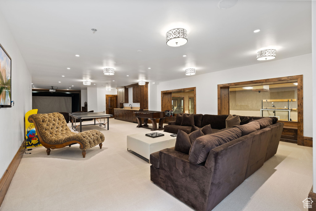 Living area with light colored carpet, pool table, and recessed lighting