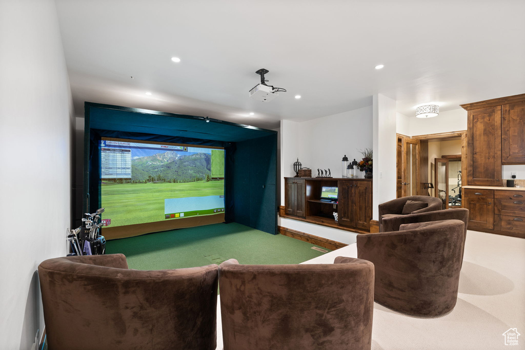 Game room featuring golf simulator and recessed lighting